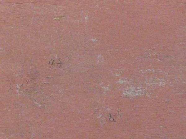Red plywood texture made up of three chipped and cracked boards, with wood brown and grey wood visible underneath the paint.